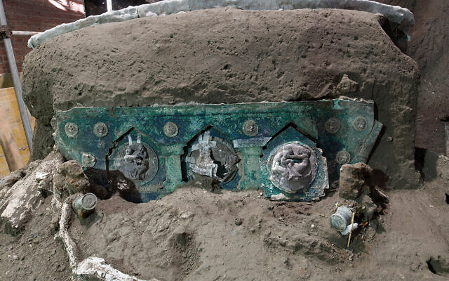 A view of a chariot, with its iron elements, bronze decorations and mineralized wooden remains, that was found in Civita Giuliana, north of Pompeii. (Parco Archeologico di Pompei via AP) A view of a chariot, with its iron elements, bronze decorations and mineralized wooden remains, that was found in Civita Giuliana, north of Pompeii. (Parco Archeologico di Pompei via AP)