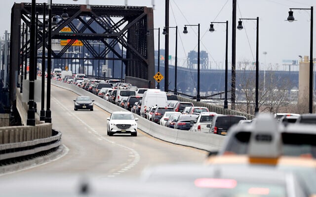 Illustrative: Speeding cars and a traffic jam in Jersey City, New Jersey, January 16, 2019. (AP Photo/Julio Cortez) Illustrative: Speeding cars and a traffic jam in Jersey City, New Jersey, January 16, 2019. (AP Photo/Julio Cortez)