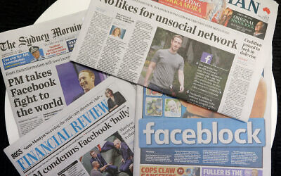 Front pages of Australian newspapers are displayed featuring stories about Facebook in Sydney, Feb. 19, 2021. (AP Photo/Rick Rycroft)