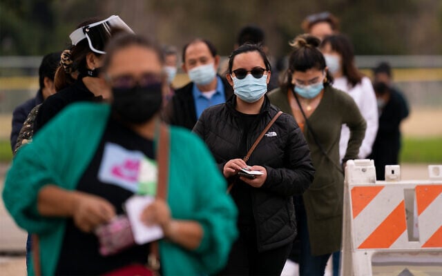 People wait in line to get COVID-19 vaccine shots at a vaccination site in Los Angeles, California, Feb. 9, 2021. (AP Photo/Jae C. Hong) People wait in line to get COVID-19 vaccine shots at a vaccination site in Los Angeles, California, Feb. 9, 2021. (AP Photo/Jae C. Hong)