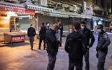 Police patrol the Mahane Yehuda market, as they enforce a night curfew during Purim, Jerusalem February 27, 2021. (Olivier Fitoussi/Flash90)