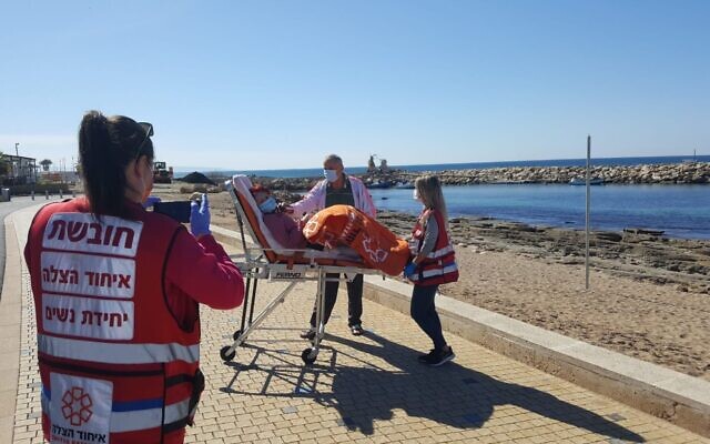 United Hatzalah medics in Nahariya take a Holocaust survivor to the beach, after a trip to a vaccination center. (Courtesy of United Hatzalah) United Hatzalah medics in Nahariya take a Holocaust survivor to the beach, after a trip to a vaccination center. (Courtesy of United Hatzalah)