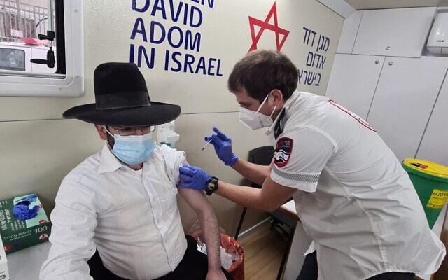 The Magen David Adom mobile vaccination unit inoculates a yeshiva student at an unspecified location, February 16, 2020 (Courtesy) The Magen David Adom mobile vaccination unit inoculates a yeshiva student at an unspecified location, February 16, 2020 (Courtesy)