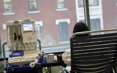 A man donates plasma at the Covid Plasma Initiative's plasma drive at the Jewish Children's Museum, Brooklyn, New York, January 27, 2021. (Courtesy/Anash.org)