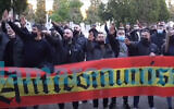 Neo-Nazis giving the Hitler salute at an event near a cemetery in Madrid, Spain on Feb. 13, 2021 (Lamarea.com via JTA)