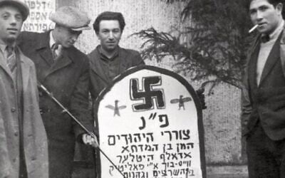 Purim with Holocaust survivors at the Landsberg DP camp in Germany, with a mock-tombstone for Haman and Hitler (Yad Vashem) Purim with Holocaust survivors at the Landsberg DP camp in Germany, with a mock-tombstone for Haman and Hitler (Yad Vashem)