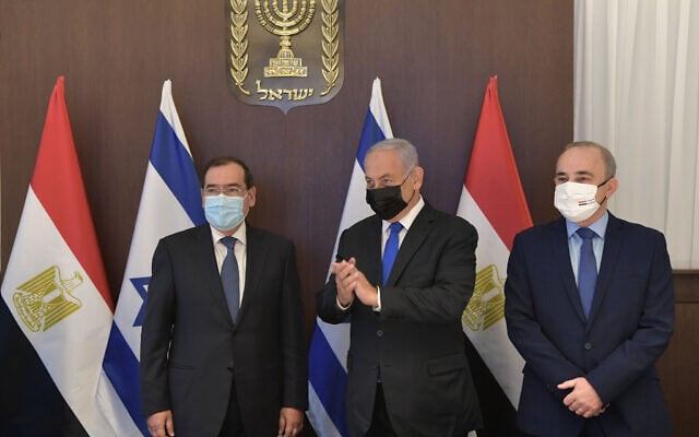 Prime Minister Benjamin Netanyahu, center, Egyptian Minister for Petroleum Tarek el-Molla, left, and Israel's Energey Minister Yuval Steinitz, in Jerusalem on February 21, 2021. (Kobi Gideon / GPO) Prime Minister Benjamin Netanyahu, center, Egyptian Minister for Petroleum Tarek el-Molla, left, and Israel's Energey Minister Yuval Steinitz, in Jerusalem on February 21, 2021. (Kobi Gideon / GPO)