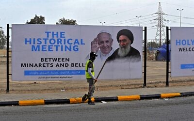 A hoarding of Pope Francis and top Iraqi Shiite cleric Grand Ayatollah Ali Sistani is pictured in Iraq's holy city of Najaf ahead of the Pope's visit to Iraq, on March 4, 2021. (Ali NAJAFI / AFP)