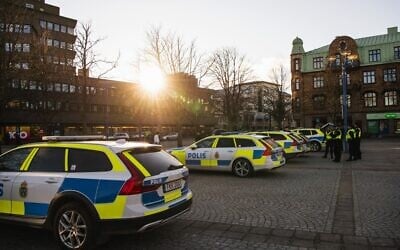 Illustrative: Police cars are parked at a main square in the Swedish city of Vetlanda on March 4, 2021, one day after a stabbing attack. (Jonathan NACKSTRAND / AFP)