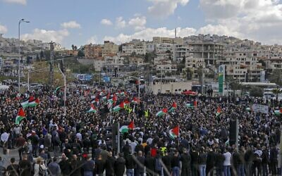 Thousands of Arab Israelis demonstrate in the mostly Arab city of Umm al-Fahm in northern Israel on March 5, 2021, against violence and organized crime calling upon the Israeli police to stop a wave of intracommunal violence. (Photo by AHMAD GHARABLI / AFP)