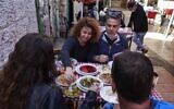 People eat at the Azura restaurant in Jerusalem, on March 7, 2021, after Israel reopened restaurants, bars and cafes to vaccinated "green pass" holders (Menaham Kahana / AFP)
