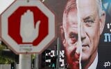 File: An election campaign billboard for Israel's Blue and White opposition party led by Benny Gantz, right, depicting him and Prime Minister Benjamin Netanyahu of the Likud party, hangs in the city of Bnei Brak, on March 14, 2021, ahead of the March 23 general election. The writing in Hebrew reads 'Benny to the Knesset or Bibi forever.' (JACK GUEZ / AFP)