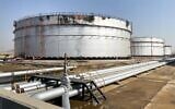 Illustrative: A damaged silo at the Saudi Aramco oil facility in Saudi Arabia's Red Sea city of Jeddah, November 24, 2020. (Fayez Nureldine/AFP)