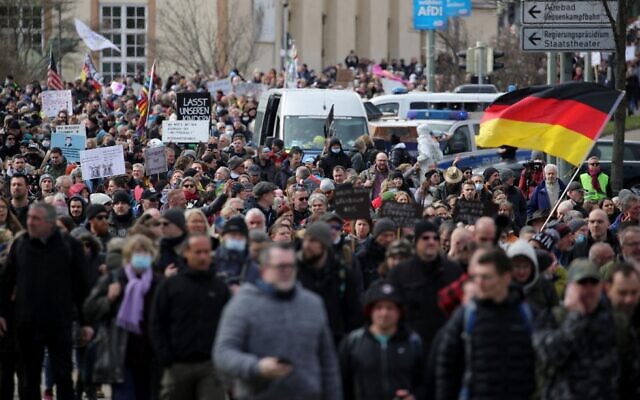 Protesters take part in a march demanding an end to the restrictive coronavirus measures in Kassel, Germany, on March 20, 2021. (Armando Babani/AFP) Protesters take part in a march demanding an end to the restrictive coronavirus measures in Kassel, Germany, on March 20, 2021. (Armando Babani/AFP)