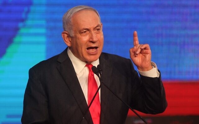 Prime Minister Benjamin Netanyahu, leader of the Likud party, addresses supporters at the party's election night event in Jerusalem, early on March 24, 2021. (Emmanuel Dunand/AFP) Prime Minister Benjamin Netanyahu, leader of the Likud party, addresses supporters at the party's election night event in Jerusalem, early on March 24, 2021. (Emmanuel Dunand/AFP)