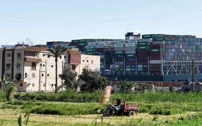 The Panama-flagged MV Ever Given container ship, lodged sideways impeding traffic across Egypt's Suez Canal waterway, on March 29, 2021, before being freed later that day. (Ahmed HASAN / AFP)