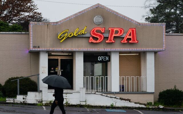 A man walks past a massage parlor where three women were shot and killed in Atlanta, March 17, 2021. (Elijah Nouvelage/Getty Images) A man walks past a massage parlor where three women were shot and killed in Atlanta, March 17, 2021. (Elijah Nouvelage/Getty Images)