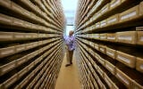In this May 8, 2008 file photo Gary Mokotoff, a Jewish genealogist from New Jersey, takes a look at name registers at the International Tracing Service in Bad Arolsen, central Germany. Germany’s International Center on Nazi Persecution has uploaded some 850,000 documents with information on ten million people collected after the end of World War II in the American occupied zone of Germany. (AP Photo/Michael Probst)