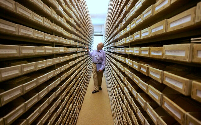 In this May 8, 2008 file photo Gary Mokotoff, a Jewish genealogist from New Jersey, takes a look at name registers at the International Tracing Service in Bad Arolsen, central Germany. Germany’s International Center on Nazi Persecution has uploaded some 850,000 documents with information on ten million people collected after the end of World War II in the American occupied zone of Germany. (AP Photo/Michael Probst) In this May 8, 2008 file photo Gary Mokotoff, a Jewish genealogist from New Jersey, takes a look at name registers at the International Tracing Service in Bad Arolsen, central Germany. Germany’s International Center on Nazi Persecution has uploaded some 850,000 documents with information on ten million people collected after the end of World War II in the American occupied zone of Germany. (AP Photo/Michael Probst)