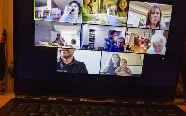In this April 8, 2020, photo, Tali Arbel and her family and friends from other places are pictured on a New York computer screen during a virtual Seder for Passover. (AP Photo/Tali Arbel)
