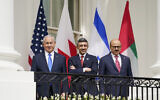 (L-R) Prime Minister Benjamin Netanyahu, United Arab Emirates Foreign Minister Abdullah bin Zayed al-Nahyan, and Bahrain Foreign Minister Khalid bin Ahmed Al Khalifa, stand on the Blue Room Balcony during the Abraham Accords signing ceremony on the South Lawn of the White House in Washington on September 15, 2020. (AP Photo/Alex Brandon)