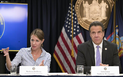 In this Sept. 14, 2018 file photo, Secretary to the Governor Melissa DeRosa, is joined by New York Gov. Andrew Cuomo as she speaks to reporters during a news conference, in New York. (AP/Mary Altaffer, File)