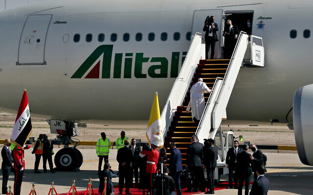 Pope Francis boards a plane upon concluding his visit to Iraq at Baghdad airport, Iraq, March 8, 2021. (AP Photo/Khalid Mohammed)