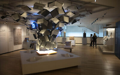 Visitors tour the Museum of the Jewish People in Tel Aviv on March 9, 2021. (AP Photo/Sebastian Scheiner)