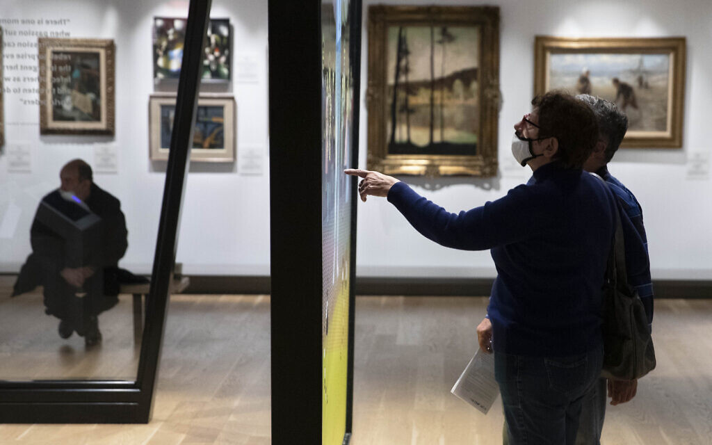 Visitors tour the Museum of the Jewish People in Tel Aviv on March 9, 2021. (AP Photo/Sebastian Scheiner)