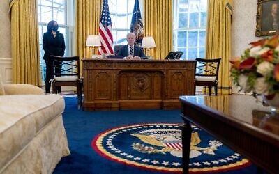 US President Joe Biden, accompanied by Vice President Kamala Harris, speaks before signing the American Rescue Plan, a coronavirus relief package, in the Oval Office of the White House, Thursday, March 11, 2021, in Washington. (AP Photo/Andrew Harnik)