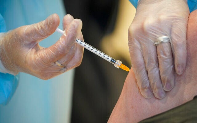 A health worker administers a dose of the AstraZeneca vaccine against COVID-19 to a patient inside the convention center known as 'La Nuvola,' The Cloud, in Rome, Italy, on March 10, 2021. (AP/Andrew Medichini) A health worker administers a dose of the AstraZeneca vaccine against COVID-19 to a patient inside the convention center known as 'La Nuvola,' The Cloud, in Rome, Italy, on March 10, 2021. (AP/Andrew Medichini)