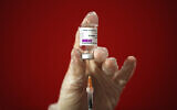 In this March 8, 2021, photo a health worker shows the media how she prepares a dose of the AstraZeneca vaccine to be administered to a patient at a vaccination center set up in front of Rome's Termini central station. (AP/Alessandra Tarantino)