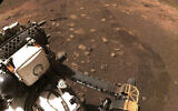 This March 4, 2021 file photo made available by NASA was taken during the first drive of the Perseverance rover on Mars. The Perseverance rover has been on Mars for a month, collecting data and making discoveries with each passing day. (NASA/JPL-Caltech via AP)