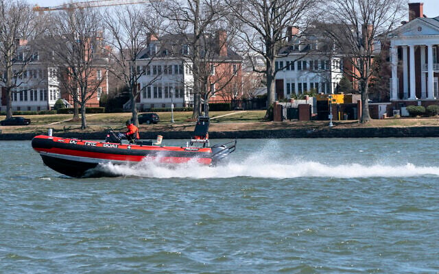 A District of Columbia Fire Boat checks buoys in the waterway next to Fort McNair, seen in background in Washington. March 19, 2021. (AP Photo/Jacquelyn Martin) A District of Columbia Fire Boat checks buoys in the waterway next to Fort McNair, seen in background in Washington. March 19, 2021. (AP Photo/Jacquelyn Martin)