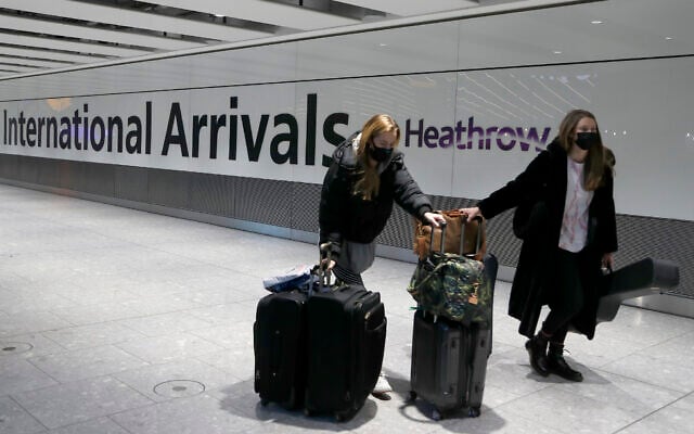 Illustrative photo of travelers arriving at Heathrow Airport in London, January 17, 2021. (AP Photo/Frank Augstein, File) Illustrative photo of travelers arriving at Heathrow Airport in London, January 17, 2021. (AP Photo/Frank Augstein, File)