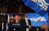Prime Minister Benjamin Netanyahu's supporters wave Likud party flags after first exit poll results for the Israeli elections at his party's headquarters in Jerusalem, Tuesday, March. 23, 2021. (AP Photo/Ariel Schalit)