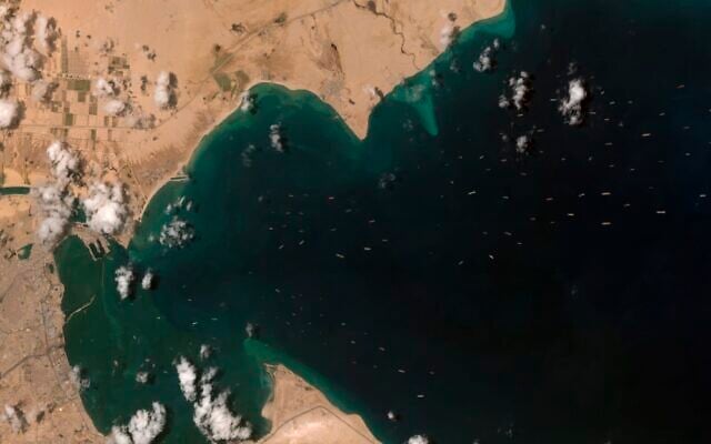 This satellite image from Maxar Technologies shows cargo ships waiting as the MV Ever Given is stuck in the Suez Canal near Suez, Egypt, Saturday, March 27, 2021 (©Maxar Technologies via AP) This satellite image from Maxar Technologies shows cargo ships waiting as the MV Ever Given is stuck in the Suez Canal near Suez, Egypt, Saturday, March 27, 2021 (©Maxar Technologies via AP)