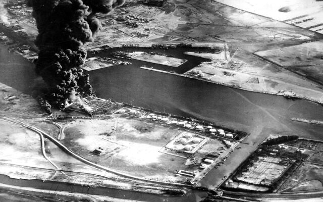 Fuel installations on the Suez Canal burn after an attack by aircraft of the Sea Venom Squadron from HMS Eagle as Britain, France and Israel intervened militarily and occupied the canal zone following Egypt nationalizing the canal, November 11, 1956. (AP Photo, File) Fuel installations on the Suez Canal burn after an attack by aircraft of the Sea Venom Squadron from HMS Eagle as Britain, France and Israel intervened militarily and occupied the canal zone following Egypt nationalizing the canal, November 11, 1956. (AP Photo, File)
