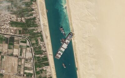 FILE - In this March 28, 2021, satellite file image from Planet Labs Inc, the cargo ship MV Ever Given sits stuck in the Suez Canal near Suez, Egypt. (Planet Labs Inc. via AP)
