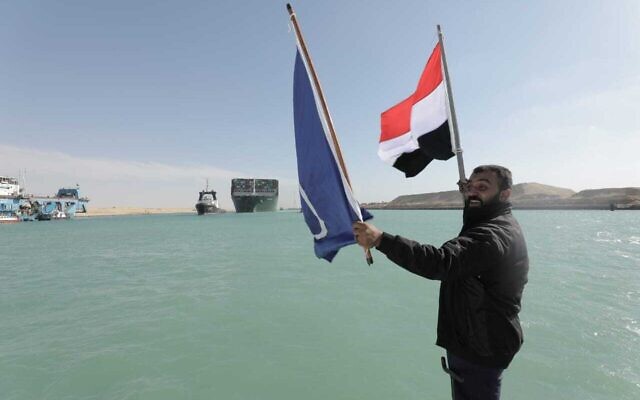 Illustrative - In this photo released by Suez Canal Authority, the Ever Given, a Panama-flagged cargo ship, is accompanied by Suez Canal tugboats as it moves in the Suez Canal, Egypt, Monday, March 29, 2021. (Suez Canal Authority via AP)