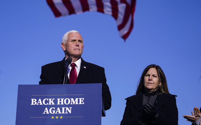 FILE - In this Jan. 20, 2021, file phot, former Vice President Mike Pence speaks after arriving back in his hometown of Columbus, Ind., as his wife Karen watches. (AP Photo/Michael Conroy, File) FILE - In this Jan. 20, 2021, file phot, former Vice President Mike Pence speaks after arriving back in his hometown of Columbus, Ind., as his wife Karen watches. (AP Photo/Michael Conroy, File)