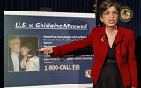 Audrey Strauss, acting United States Attorney for the Southern District of New York, points to a photo of Jeffrey Epstein and his ex-girlfriend Ghislaine Maxwell, July 2, 2020. (AP Photo/John Minchillo, File)