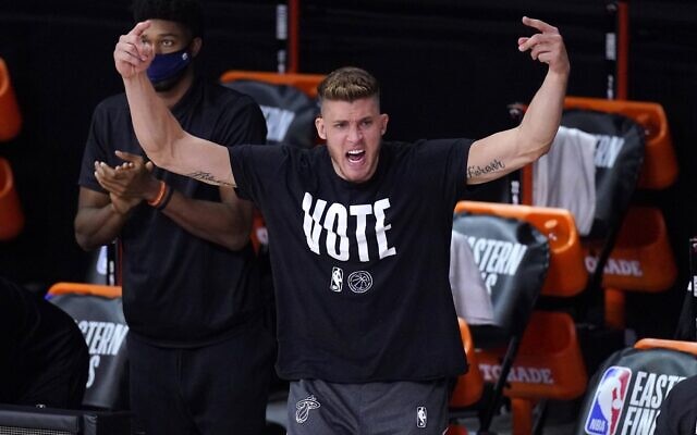 Miami Heat's Meyers Leonard (0) cheers on the team from the sideline during the second half of an NBA conference final playoff basketball game against the Boston Celtics on September 19, 2020, in Lake Buena Vista, Florida. (AP Photo/Mark J. Terrill) Miami Heat's Meyers Leonard (0) cheers on the team from the sideline during the second half of an NBA conference final playoff basketball game against the Boston Celtics on September 19, 2020, in Lake Buena Vista, Florida. (AP Photo/Mark J. Terrill)
