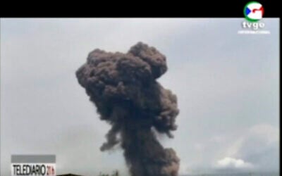 This TVGE image made from video shows smoke rising over the blast site at a military barracks in Bata, Equatorial Guinea, March 7, 2021. (TVGE via AP)