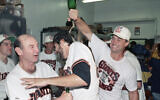 FILE - In this Oct. 9, 1989, file photo, San Francisco Giants catcher Terry Kennedy, right, pours sparkling wine over the head of Steve Bedrosian, center, as pitching coach Norm Sherry watches at left following the Giants' victory over the Chicago Cubs to secure the National League pennant in San Francisco (AP Photo/Eric Risberg, File)