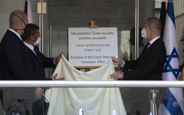 Czech Prime Minister Andrej Babis, right, Israeli Foreign Minister Gabi Ashkenazi, center left, and Israeli Public Security Minister Amir Ohana unveil a sign during a ceremony at the new Embassy of the Czech Republic Jerusalem office in Jerusalem on March 11, 2021. (AP Photo/Sebastian Scheiner, Pool) Czech Prime Minister Andrej Babis, right, Israeli Foreign Minister Gabi Ashkenazi, center left, and Israeli Public Security Minister Amir Ohana unveil a sign during a ceremony at the new Embassy of the Czech Republic Jerusalem office in Jerusalem on March 11, 2021. (AP Photo/Sebastian Scheiner, Pool)