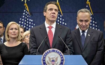 In this Dec. 3, 2012, file photo, New York Gov. Andrew Cuomo is joined by the New York Congressional delegation including Sen. Kirsten Gillibrand, left, and Sen. Charles Schumer, right, for a news conference at the Capitol in Washington (AP Photo/J. Scott Applewhite, File)