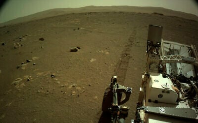 This Mar. 7, 2021 photo provided by NASA shows tire tracks left by the Mars Perseverance rover (NASA/JPL-Caltech via AP) This Mar. 7, 2021 photo provided by NASA shows tire tracks left by the Mars Perseverance rover (NASA/JPL-Caltech via AP)