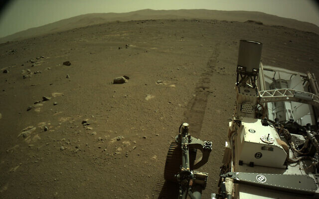 This Mar. 7, 2021 photo provided by NASA shows tire tracks left by the Mars Perseverance rover (NASA/JPL-Caltech via AP) This Mar. 7, 2021 photo provided by NASA shows tire tracks left by the Mars Perseverance rover (NASA/JPL-Caltech via AP)