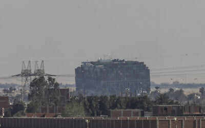 Ever Given, a Panama-flagged cargo ship that is wedged across the Suez Canal and blocking traffic in the vital waterway is seen March 29, 2021 (AP Photo/Mohamed Elshahed)